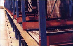 Here you can see the pallet entry guides that help forklift operators load pallets onto the gravity roller conveyor.