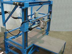 The Traverse holds and propels the metering, mixing and dispensing head.