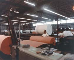 Here is Polyurethane foam bun that is being peeled like veneer from a log for use as foam backing.