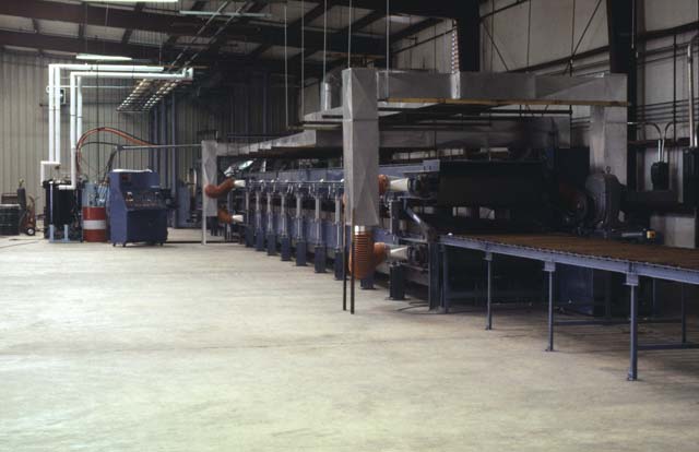 Kornylak manufactures the Armorbelt Foamboarders a metal belt conveyor for the production of foam core panels.