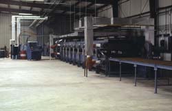 Kornylak manufactures the Armorbelt Foamboarders a metal belt conveyor for the production of foam core panels.