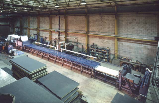 The high-speed continuous production Process Tunnel, and in the foreground are panels showing both side trimmed and folded edges.