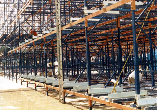 The Palletflo rails have been installed before the rack-supported roof was put on the building.