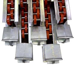 A group of zinc coated Palletflo rails with rail stops.