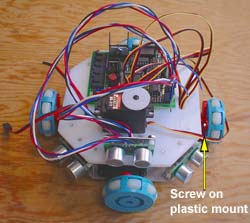 A plastic mount is use to attach the wheel to a motor. Click to enlarge.