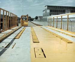 The cargo deck can be tilted forward or backward, rolled right or left, and shifted from side to side to adjust the deck to the aircraft or the dock.