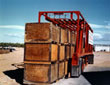 The Kornylak Strad-O-Lift is the most efficient, laborsaving device designed for highway transportation. Combining the advantages of a straddle carrier and a conventional semi-trailer, Strad-O-Lift, driver controlled, loads itself in less than a minute.