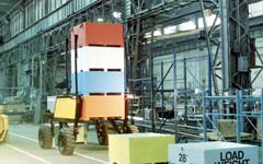 Straddle Fork is designed to carry four full bins and delivers them to the roadside for delivery to the processing center.