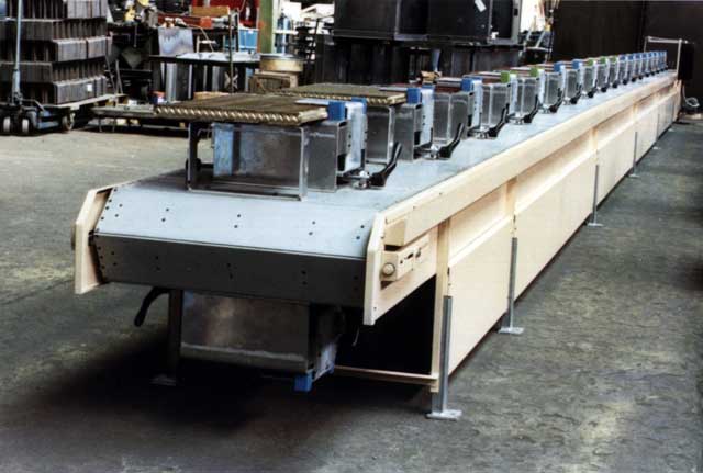 Fixtures may be mounted on the belt by welding or bolting.