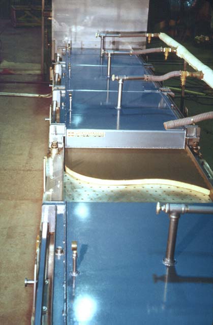This view shows the paper entering the Process Tunnel� at the top, and below is the Process Tunnel with one section of the top removed.