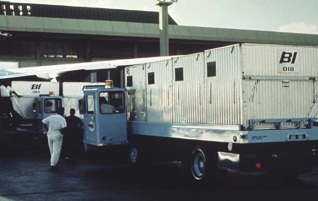 A high-lift fully loaded with aircraft cargo containers.