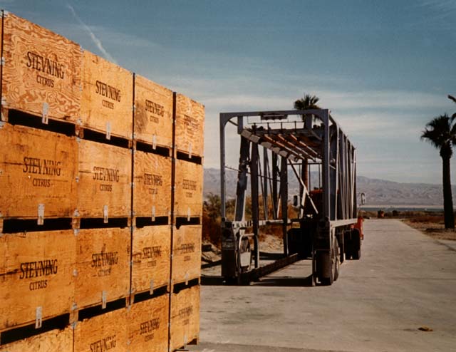 Strad-O-Lift� can carry 32 produce bins to or from the fields.