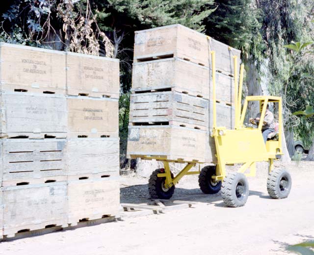 Straddle Fork� places 32 picking bins in a row for a quick and easy pick-up by a Strad-O-Lift trailer.